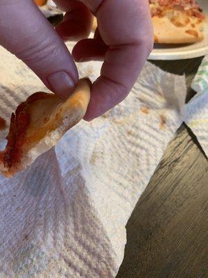 My pepperoni pizza crust. Very thin. The other side of the pizza wasn't this thin but still was pretty thin.
