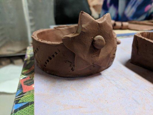 These are the pictures right after pottery class. Can't wait to see them after they're glazed