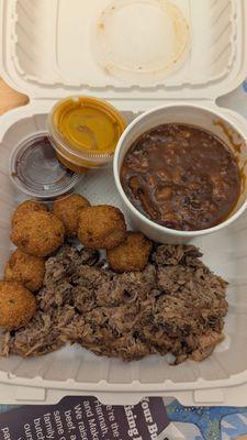 One meat plate (pulled pork) with two sides (hush puppies and brisket bean chili) $20