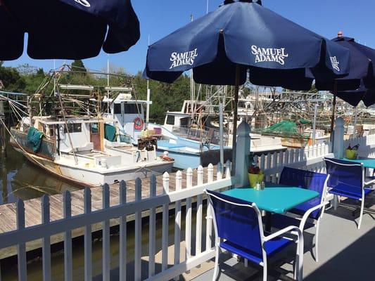 View of shrimp boats from outdoor patio.
