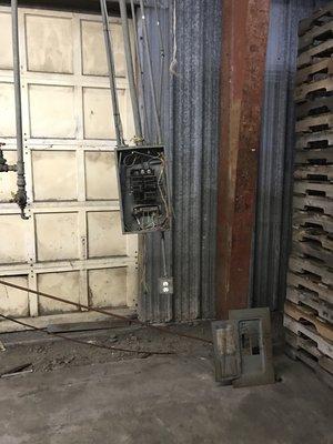 Panel hanging is a code violation per the NEC