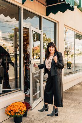 Owner Amanda Goddard outside of Boutique 44 on Bond St. Wearing Clara Sunwoo faux leather styles.