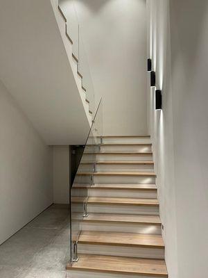 1/2" tempered glass with   polished nickel spigots. Plano TX