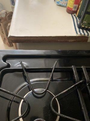 The side of counter should be white not brown. It was peeled off.