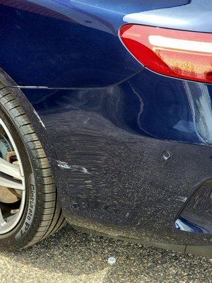 Damage done to the car which resulted in the 1900 dollar repair. i