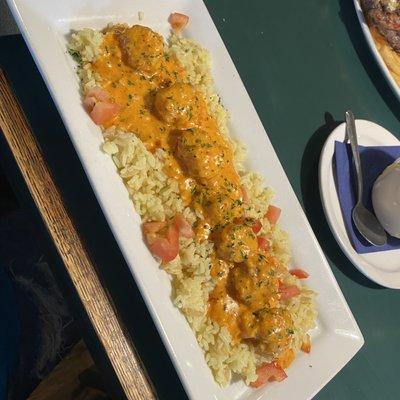 Scallops over rice-meh rice was better than the craved scallops