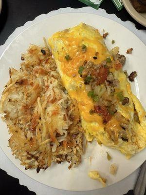 Veggie omelette with added sausage and cheese.