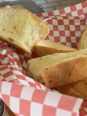 Garlic bread had spots that were soaked in oil and others parts that were plain bread.