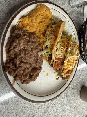 3 ground beef hard tacos with rice and beans. Really good , like Grandmas