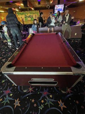 Billiards. Doesn't eject all the pool balls. Buyer beware.