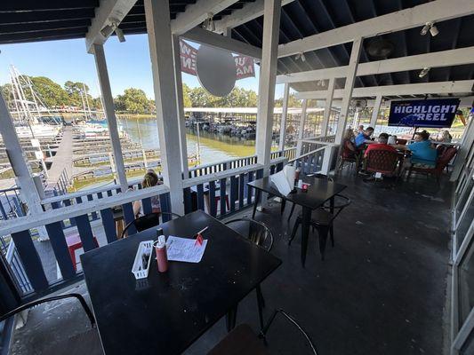 Back patio, with TVs and a view of the marina