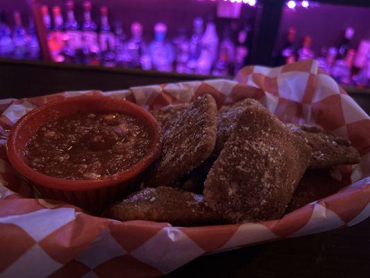 Deep fried ravioli with pizza sauce