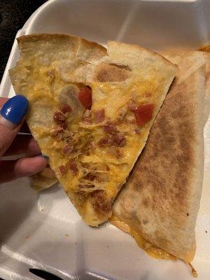 "Cheese" quesadilla. The owner told me I'm an idiot for assuming a cheese quesadilla only has cheese in it.