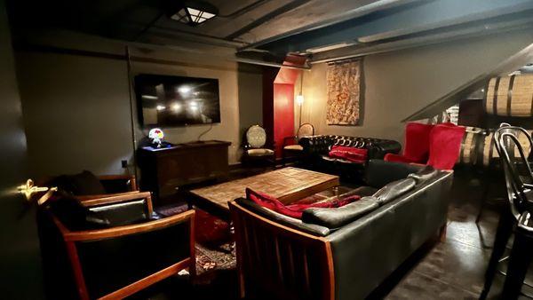 Downstairs speakeasy feel with ample places to sit and sip