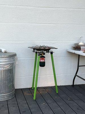 Portable grill from caterer cooking some yummy beef sliders.