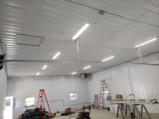 Pole building lights, conduit runs for outlets, garage door openers and sub panel.