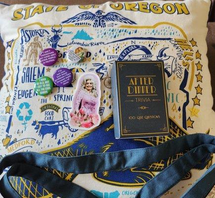 Pillow, sticker, trivia game, pins.