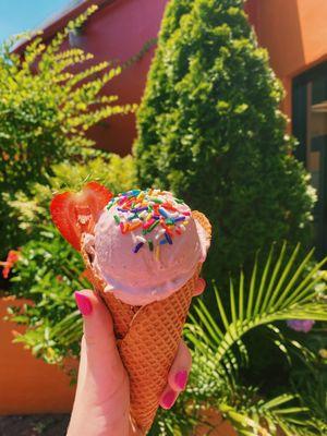 Strawberry scoop in a waffle cone!