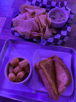 Spinach and artichoke dip (top), grilled cheese with tater tots (bottom)