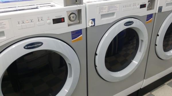 Inside the laundromat. Newer washers.