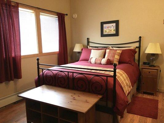 Queen bed and space with dollhouse behind the closet to sleep a child over the age of 7. The room has a lovely view of Bear Lake.