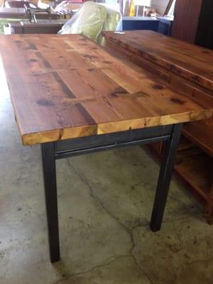 Custom built farm table from reclaimed wood and metal.