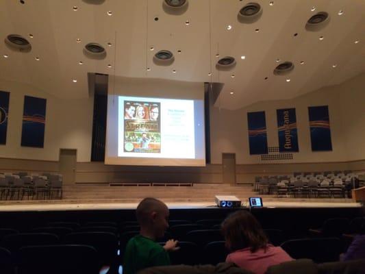 The big screen down for a movie showing.