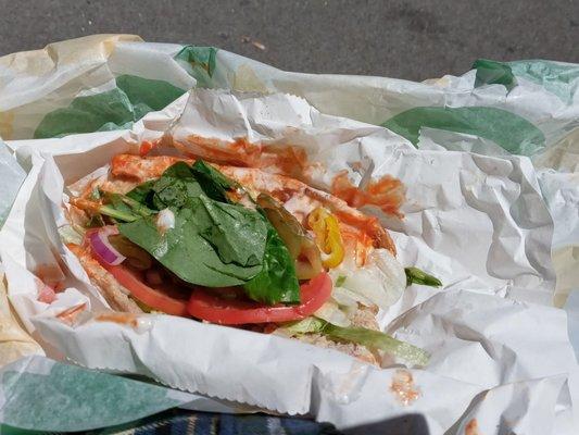 6 inch sub with roasted chicken breast, lettuce, tomatoes, spinach, onions, cucumbers, pickles, Buffalo sauce and ranch dressing
