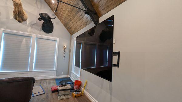 The TV mounted with some Animal mounts we also installed.
