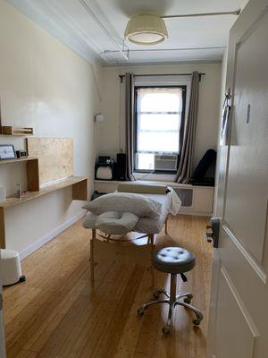 View of the Reiki treatment space that will rented for your session. Room type may vary.