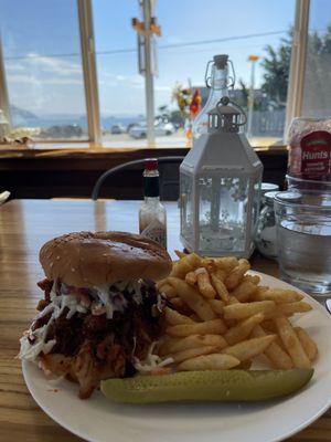 Pulled pork sandwich with fries. We added cole slaw. So delicious and fresh!