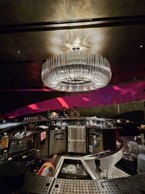 Entire bar area - So much stainless steel. Makes the area seem so cold and uninviting. Uncomfortable for the eyes if sensitive to brightness