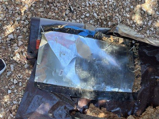 The flashing and roof material that covered the hole in the plywood