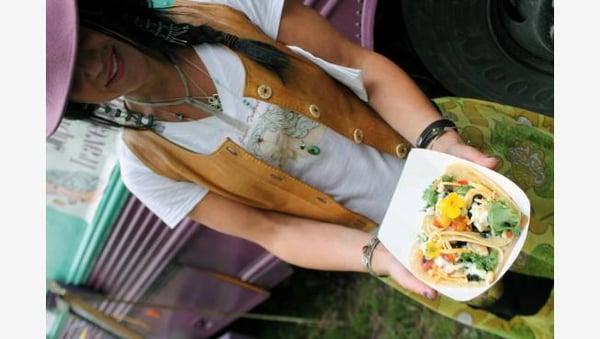 Chef and owner, Laura, displaying one of our many taco items!