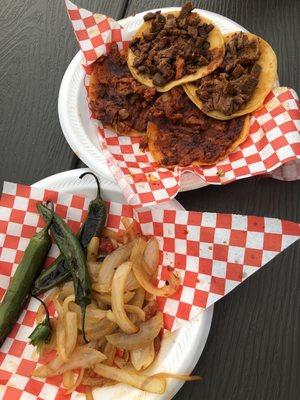Onions and grilled jalapeños come with each order. Pastor and Carne Asada street tacos.