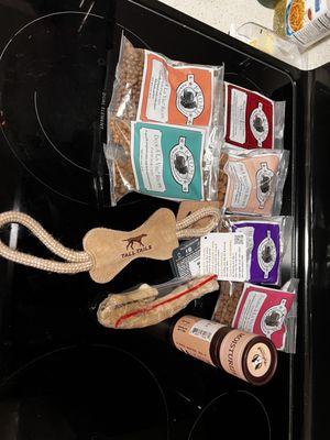 Dog toy, duck neck. Sample food.