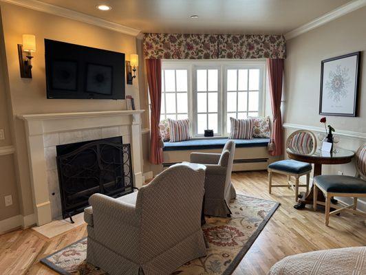 Fireplace and comfy chairs to relax in.