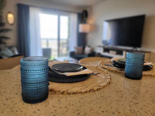 Beautifully stocked full size kitchen with complete sets of glass and ceramic dishware, pots, pans, and utensils.