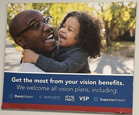 Poster on wall with vision benefits that are welcome.