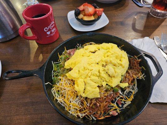Cornbeef hash skillet on a bed of hot hash browns.