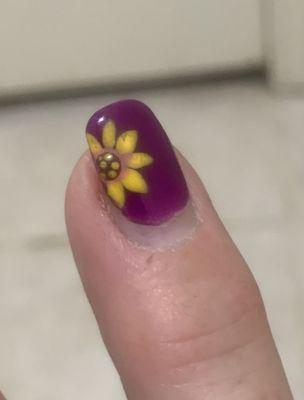 Nails last. Still pretty after three weeks and what detail in this hand-painted sunflower