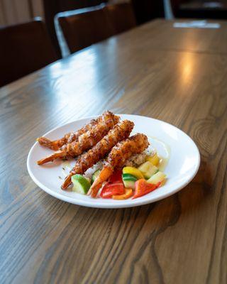 Coconut Shrimp:
Jumbo shrimp, coconut dipped, fresh pineapple and coconut sauce. Served with cilantro rice and chef vegetables.