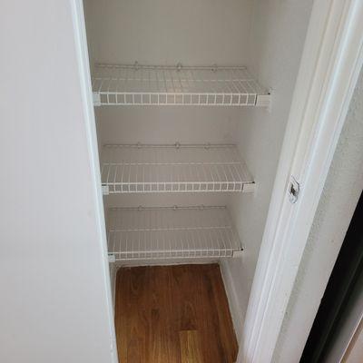 Cheap wire racks in pantry and ALL the bedroom and bathroom closets. Most are broken.