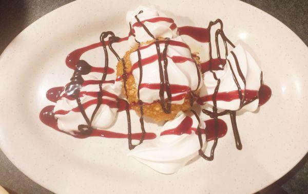 Fried ice cream with strawberry and chocolate drizzle