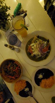 steak fajita bowl and steak enchiladas, plus two sides of rice and beans