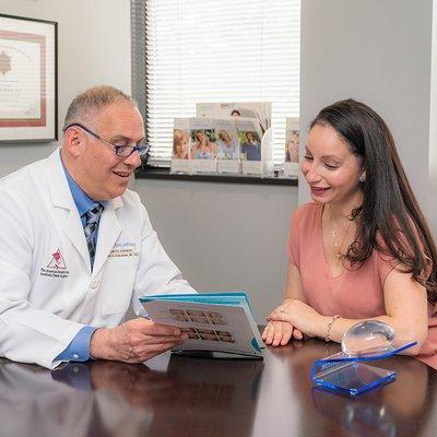 Dr. Herbstman Discussing Breast Augmentation Procedures with Patient