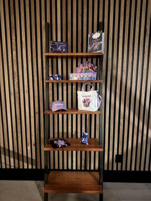 Purple hat on the 3rd shelf looked so professional thanks to this company.