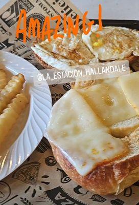 Egg & cheese croissant with potato fries