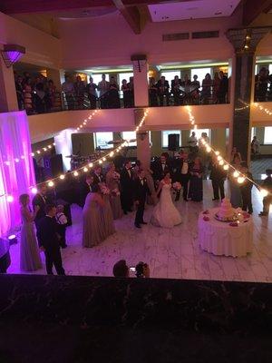 The upstairs cocktail hour crowd looking down as the wedding party was introduced.