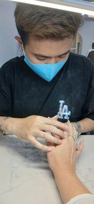 Tyler doing my nails.